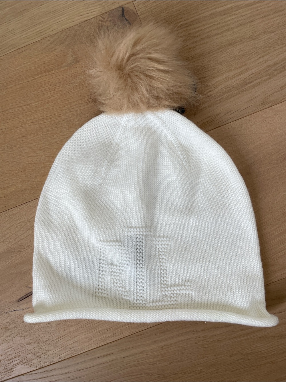 Women’s cream Ralph Lauren Beanie with Pom. Never worn.